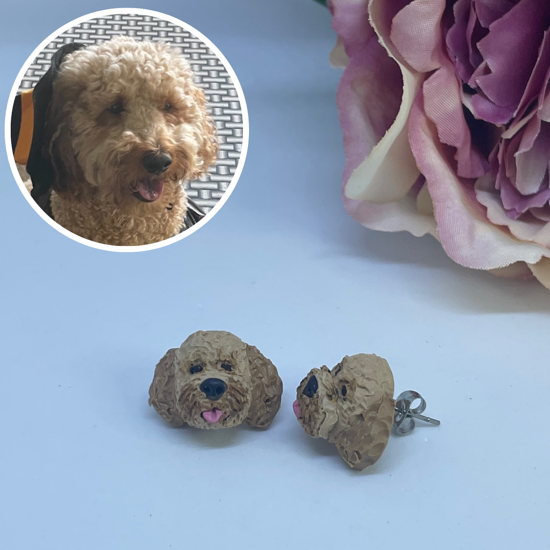 Handmade polymer clay custom pet stud earrings of a cavoodle dog.